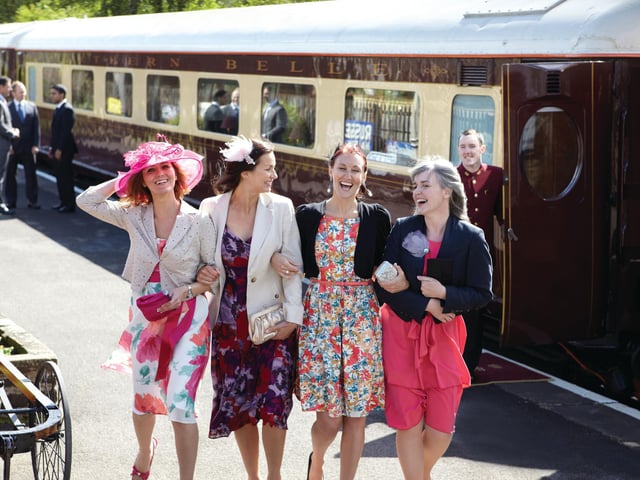 All aboard ... happy passengers in front of the Northern Belle train