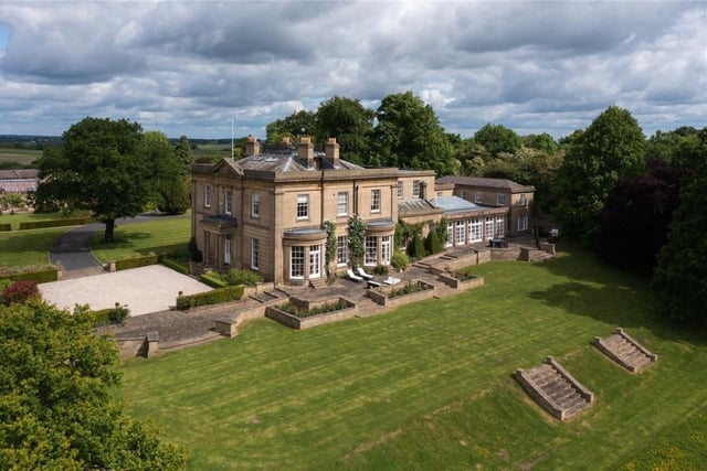 This handsome Grade II listed Georgian manor house is located between the villages of Scarcroft and Thorner on Thorner Lane, and is set in about 60 acres of grounds. Outside, formal terracing, lawns, a walled garden, parkland and managed woodland surrounding a wildlife lake all make this property stand out. Inside, the house provides close to 15,000 square feet of beautifully presented and classically proportioned accommodation, including a host of formal and informal reception rooms and a total of eight bedrooms with bathrooms.