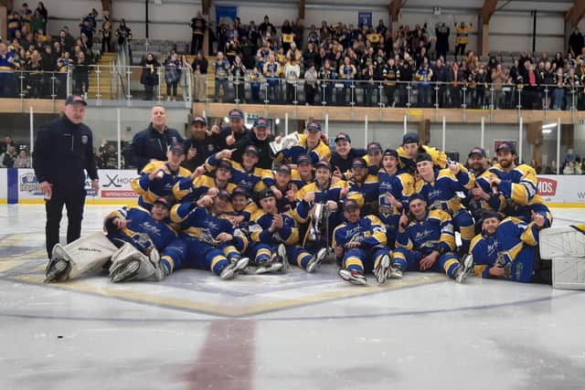 PARTY TIME: Leeds Knights' players and staff celebrate with the NIHL National league championship trophy on Sunday night at 'The Castle'.