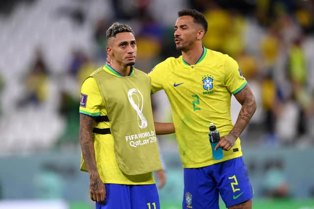 PAIN: Raphinha, left, is consoled by Danilo after Brazil's shock World Cup exit to Croatia. Photo by Laurence Griffiths/Getty Images.