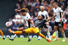 BAD DAY: For Leeds United's Weston McKennie, again, as he tries to tackle Fulham's Antonee Robinson. Photo by Clive Rose/Getty Images.