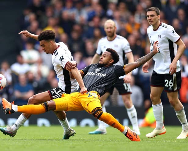 BAD DAY: For Leeds United's Weston McKennie, again, as he tries to tackle Fulham's Antonee Robinson. Photo by Clive Rose/Getty Images.