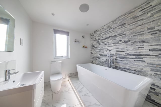 Upstairs the central landing offers access to a total of four bedrooms and the house bathroom which offers a bespoke, part-tiled finish having a feature free-standing bath.