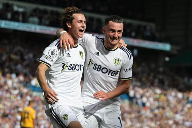 LEEDS, ENGLAND - AUGUST 06:  Brenden Aaronson (L) of Leeds United celebrates with team mate Jack Harrison after scoring the match winning goal during the Premier League match between Leeds United and Wolverhampton Wanderers at Elland Road on August 06, 2022 in Leeds, England. (Photo by David Rogers/Getty Images)
