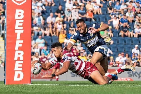 Leeds's Sam Lisone can't prevent Kai Pearce-Paul scoring for Wigan. Picture by Allan McKenzie/SWpix.com.