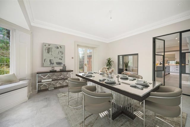 Dine in style in this room with built in seating to the bay window, and doors leading outside.