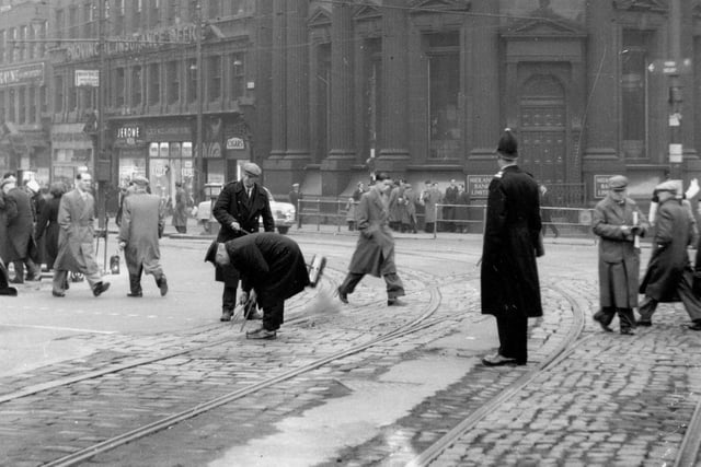 Tram line point cleaning being carried out at junction of City Square with Boar Lane (possibly for the last time) in March 1956. Midland Bank can be seen in the background.