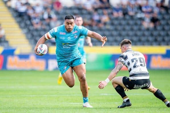 Sam Lisone completes his hat-trick with a long-range try in Rhinos' win at Hull FC. Picture by Allan McKenzie/SWpix.com.