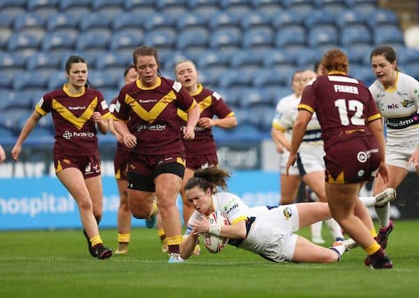 Eloise Hayward scores for Rhinos in last month's 80-0 win at Huddersfield. Picture by John Clifton/SWpix.com.