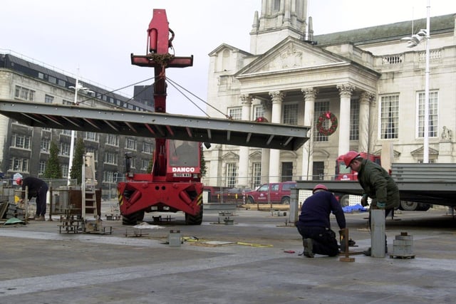 Construction workers building the new ice rink in Millennium Square, Leeds, on Sunday, January, 14 2001. The ice rink would only be in Leeds for five weeks.