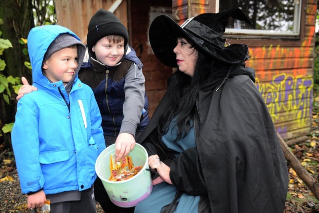Halloween at Swithens Farm, pumpkin festival in Rothwell. Alfie, eight and Jaxon, five meet Jules the Witch in the wood on the way to the pumpkins