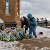 Tributes are laid in memory of Sarah Keeling and Mark Ratcliffe as the search continues for Grace Keeling following the tragedy off the coast of Withernsea
