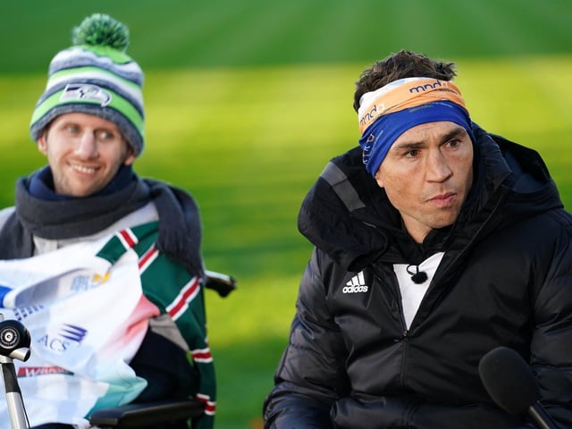 Kevin Sinfield, with Rob Burrow, is interviewed at Headingley Stadium after completing the 'Extra Mile Challenge' from Leicester to Leeds in November 2021, which saw him run 101 miles in 24 hours.