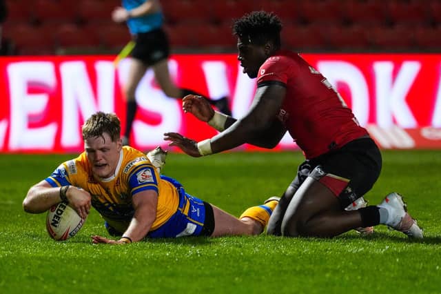 Former Leeds Rhinos forward Justin Sangare can't prevent James McDonnell scoring in the visitors' 28-0 win at Salford Red Devils. Picture by Olly Hassell/SWpix.com.