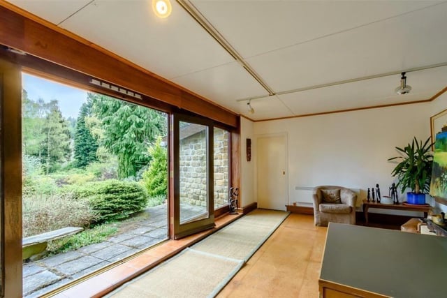 Entertaining is made easy in summer by sets of French doors in the sitting room and the annexe, that open to patio areas fronting the leafy gardens.