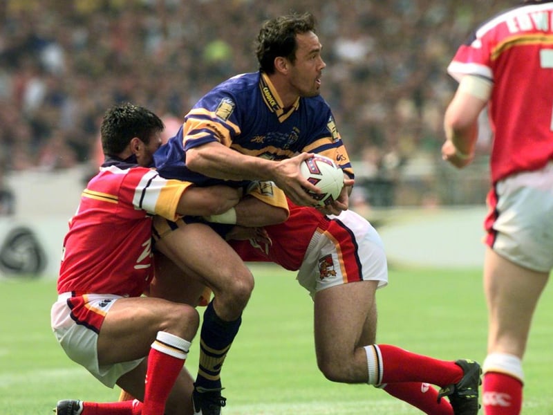 Richie Blackmore is stopped by the Broncos defence.