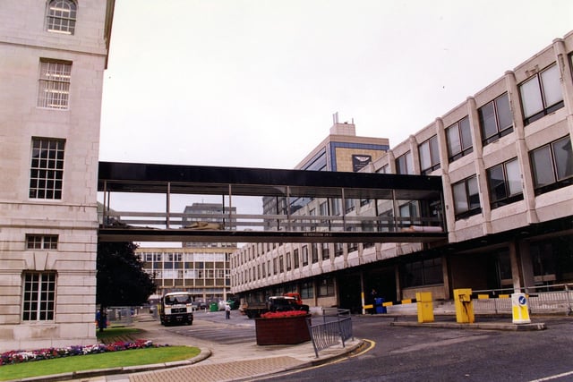 A view from Portland Crescent showing the rear wing of the 1933 built Leeds Civic Hall, left and the 1969 built annexe to the right. A connecting glass panelled bridge extends between the two buildings.