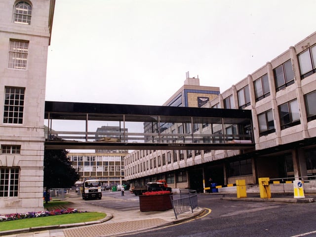 A view from Portland Crescent showing the rear wing of the 1933 built Leeds Civic Hall, left and the 1969 built annexe to the right. A connecting glass panelled bridge extends between the two buildings.