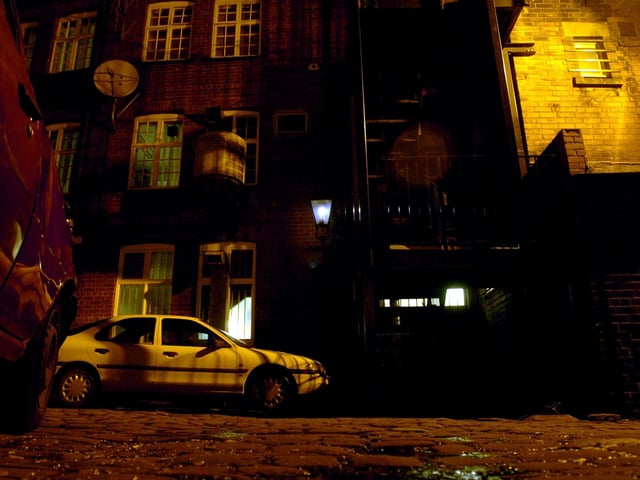 Gas lamps light the way in Bramley's Yard, behind The Vine Pub, just off The Headrow, in  January 2004.