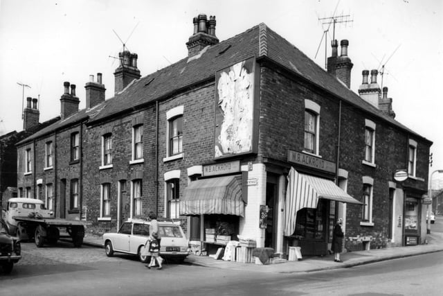 Through houses on Livinia Street run from the left edge of this view. On the corner is W.B. Ackroyd's greengrocers, also selling fish, this number 159 Camp Road. Camp Road continues to the right. At this time Camp Road was also known as Oatland Lane. Pictured in June 1967.