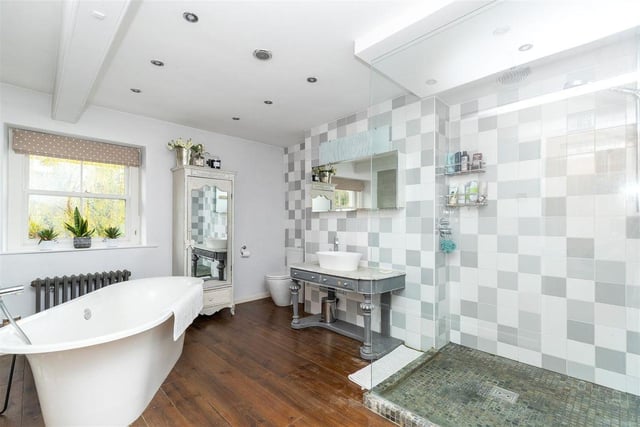 A large and impressive four piece suite with a double walk in shower, tiled flooring and walls, rain shower head and glass screen completes the unit. The free standing bath is ideal for those lovely long soaks.