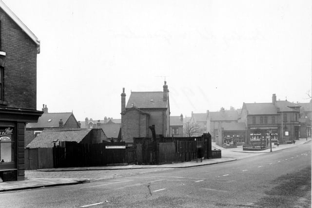 Looking at the south west side of Burley Road in January 1955. To the left of the picture is  'A. Woodhouse & Sons, painters'. To the right of the picture, at the junction of Haddon Road, is the 'Leeds Industrial Co-operative Society Ltd'.