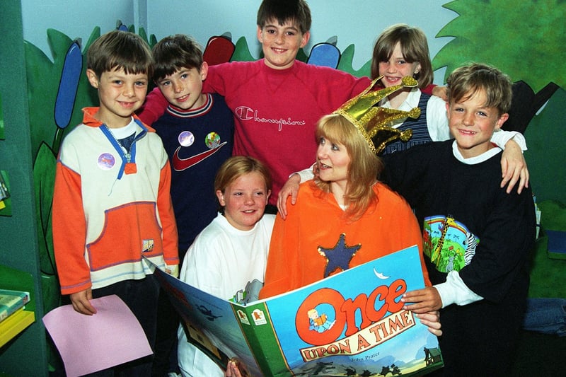 July 1998 and Rothwell Library held 'The Magic Carpet Ride', a reading game aimed giving children an incentive to keep up their reading during the holiday period. Storyteller, librarian Chris Barber sets the scene for the game with children, back row from left, David Gould, Arron Kelly, Nathan Elliott, Ashleigh Baker and Kieran Marshall with Danielle Marshall at the front.