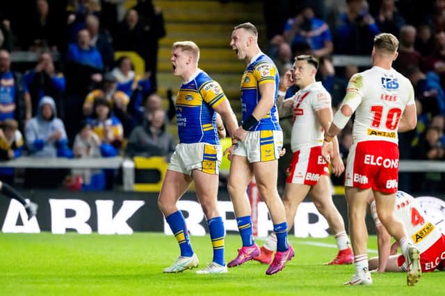 Leeds Rhinos' James McDonnell, left, celebrates his try against St Helens with teammate Harry Newman, right. Picture by Allan McKenzie/SWpix.com.