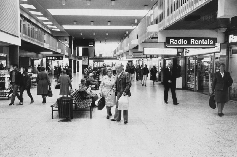 Shoppers walk past Radio Rentals in the Merrion Centre