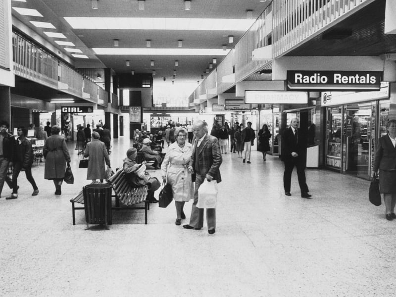 Shoppers walk past Radio Rentals in the Merrion Centre