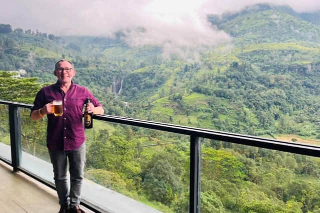 Raising glass to Scottish lookie-likey Glenloch Sri Lankan misty mountain range vista
