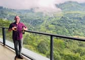 Raising glass to Scottish lookie-likey Glenloch Sri Lankan misty mountain range vista