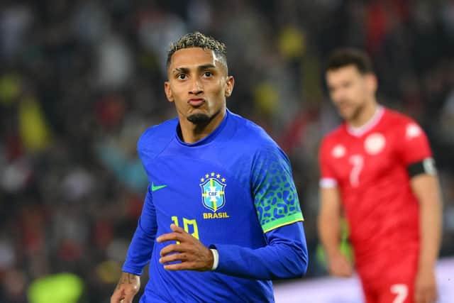 Brazil's forward Raphinha celebrates scoring his team's fourth goal during the friendly football match between Brazil and Tunisia at the Parc des Princes in Paris on September 27, 2022. (Photo by Anne-Christine POUJOULAT / AFP) (Photo by ANNE-CHRISTINE POUJOULAT/AFP via Getty Images)