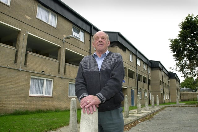 Dennis Pontefract, chairman of the Claremont Grove Tenants Association stands in front of the complex which is to get CCTV cameras. Pictured in September 2003.