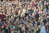 Thousands of Wakefield Trinity fans are lining the route of this afternoon's open top bus parade to celebrate the club's Super League Grand Final victory.