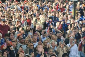 Thousands of Wakefield Trinity fans are lining the route of this afternoon's open top bus parade to celebrate the club's Super League Grand Final victory.