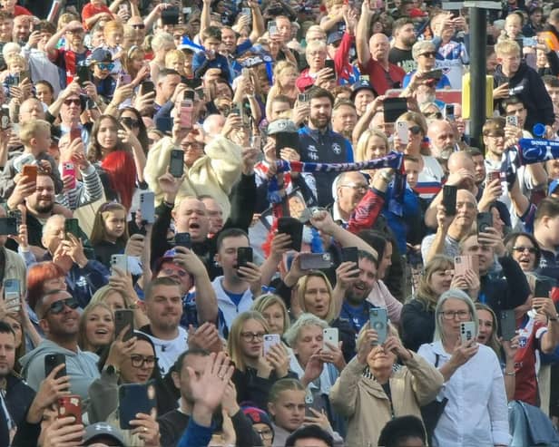 Thousands of Wakefield Trinity fans are lining the route of this afternoon's open top bus parade to celebrate the club's Super League Grand Final victory.