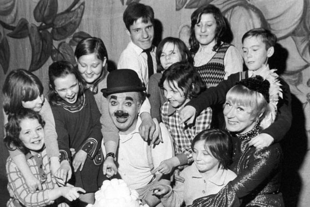 Children of the Women's Circle meet Charlie Cairoli at Leeds City Varieties during a production of the pantomime Jack and the Beanstalk in January 1973. Pictured with the famous clown is Ann Langford.