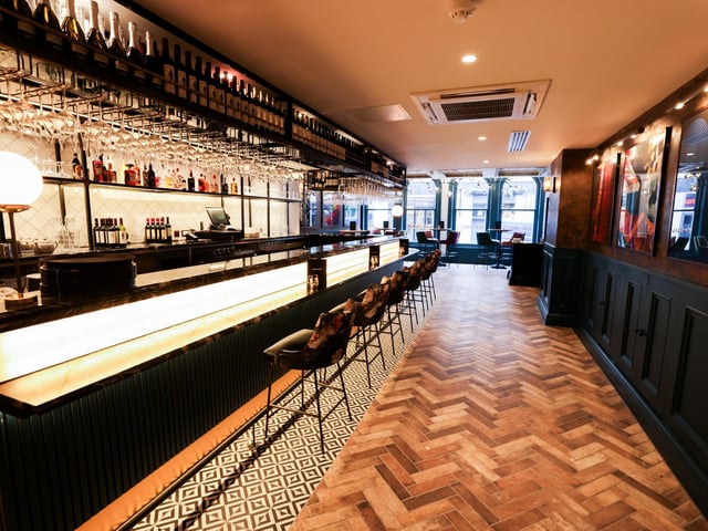 The restaurant features an onsite bar, with a full bar gantry, cocktail and wine service