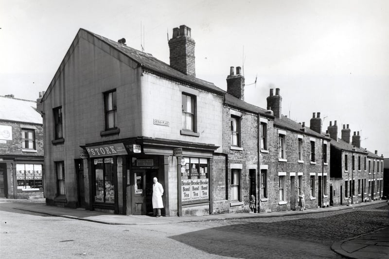 Camp Road and Sedan Place in July 1958. On the left is Woerth Street with a shop at number 92 Camp Road top the left edge. At the time this was owned by James Abbot and had previously been owned by Emily Richardson. Next number 90a Camp Road (Oatland Lane). A man in a white overall is in the doorway of 90, which is a grocers shop, business of S.C. Stocks. Sedan Place is next, number 3 has a girl in the doorway.