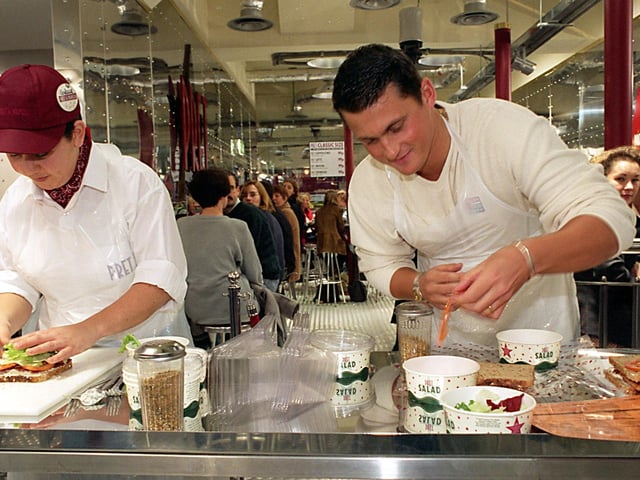 Cricket legend Darren Gough makes sandwiches alongside team leader Gaelle Badaoul at Pret-A-Manger on Bond Street in November 1997.
