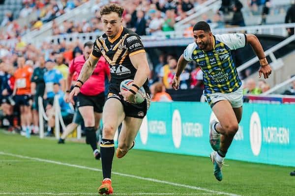 Elliot Wallis scores his first Tigers try in the Magic Weekend win over Leeds. Picture by Alex Whitehead/SWpix.com.
