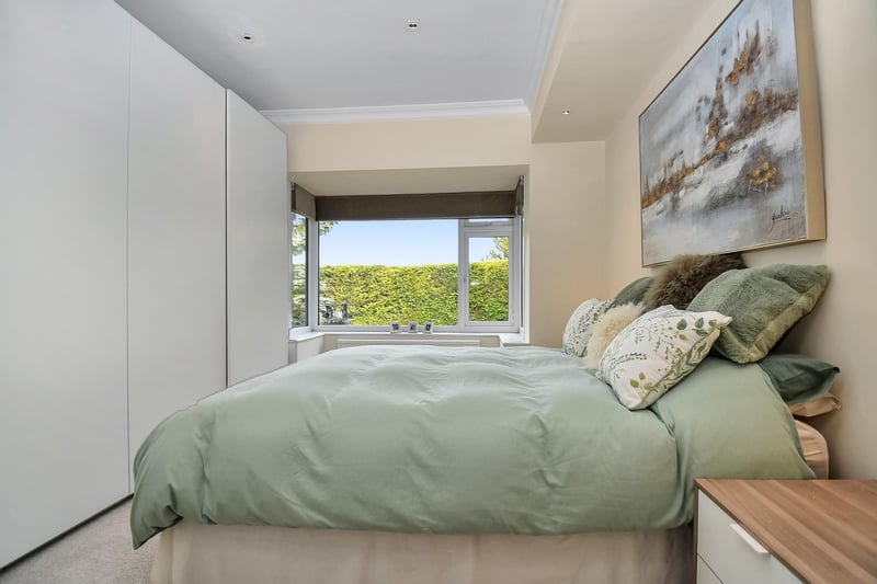 There are three double bedrooms, including this master bedroom complete with fitted wardrobes.