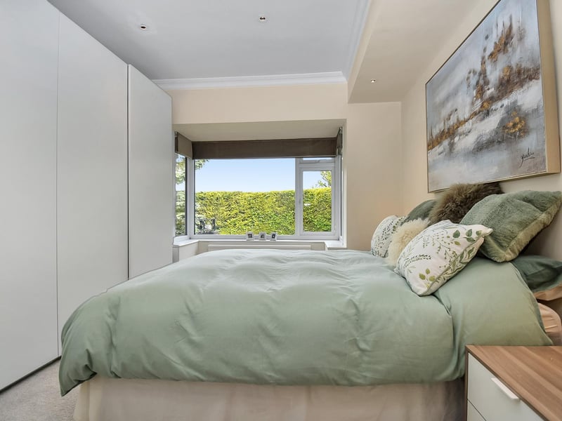 There are three double bedrooms, including this master bedroom complete with fitted wardrobes.