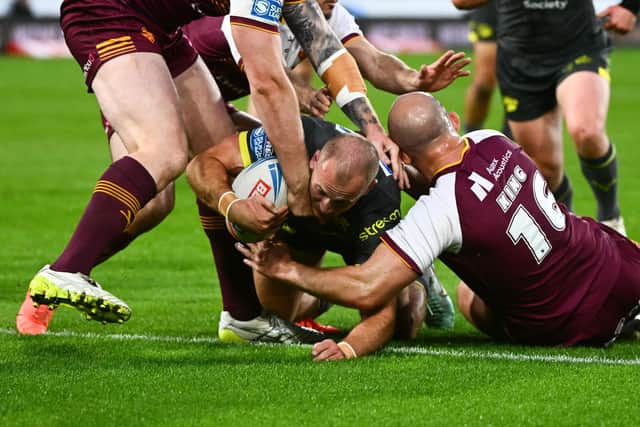 Leeds Rhinos' Jarrod O'Connor forces his way over for a try during the big win at Huddersfields Giants. Picture by Olly Hassell/SWpix.com.