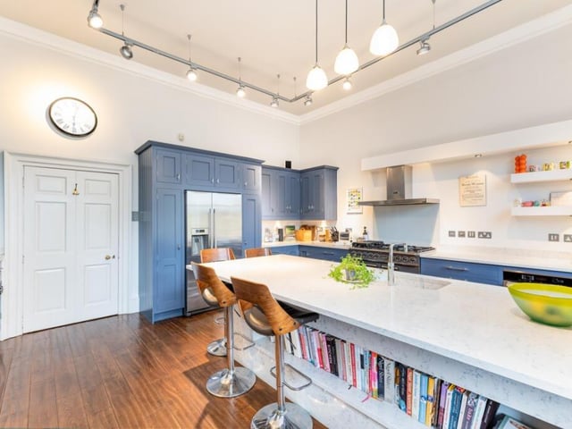 The kitchen is modern contemporary in style and features refined detailing throughout.