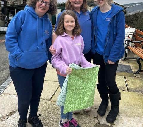 Autumn delivers the first batch of blankets to Emma, Sarah and Alyssa from Yorkshire Cat Rescue.