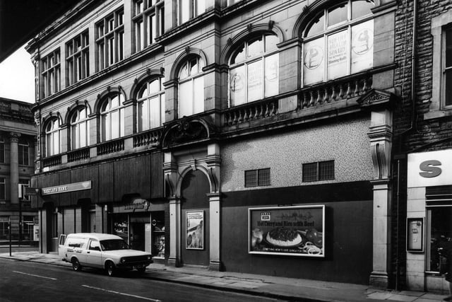 The former Morley Industrial Co-operative Society Ltd. building on Albion Street by the junction with Queen Street, left, in March 1982. It was occupied by Barclays Bank and Candyman tobacconists and confectioners. Just visible on the right is the edge of Servo Discount Centre. Part of Morley Town Hall can be seen on Queen Street on the left.