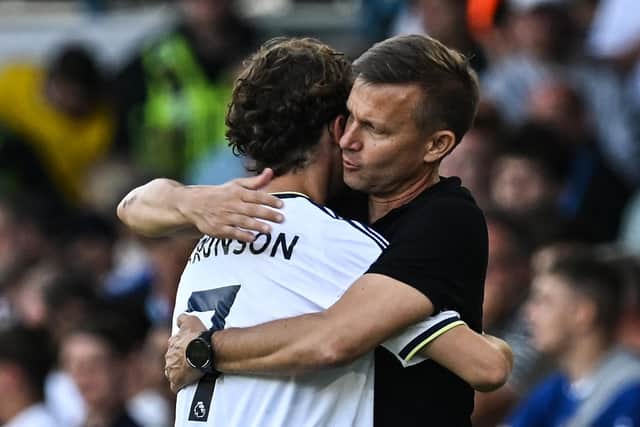 Leeds United's Brenden Aaronson embraces head coach Jesse Marsch on the touchline at Elland Road (Photo by PAUL ELLIS/AFP via Getty Images)