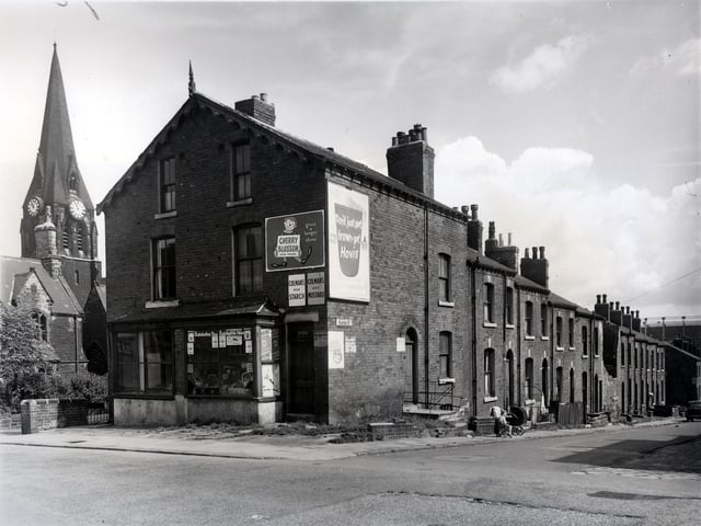 Camp Road and Glover Street in July 1958. St. Matthews Church is on the left, built in 1903 the church was demolished when the area was redeveloped in the late 1960s. The last vicar was Hugh Hilary Lewis, the vicarage was situated on Camp Road, in front of the church. The road between the church and number 78, which is an empty shop, was Church Hill. On the right number 76 is a greengrocers, business of H. Yates. Looking down right. This was a gasometer is on the right. This was situated off Barrack Street, Sheepscar.